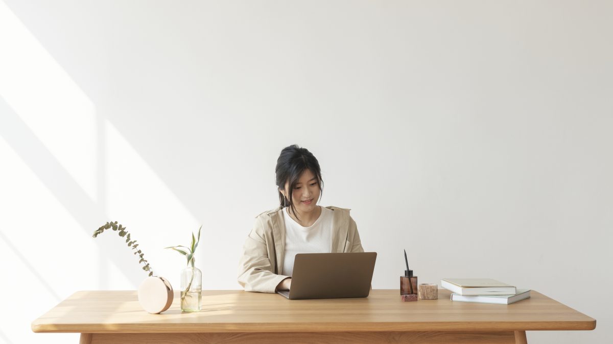 Happy Asian woman working from home