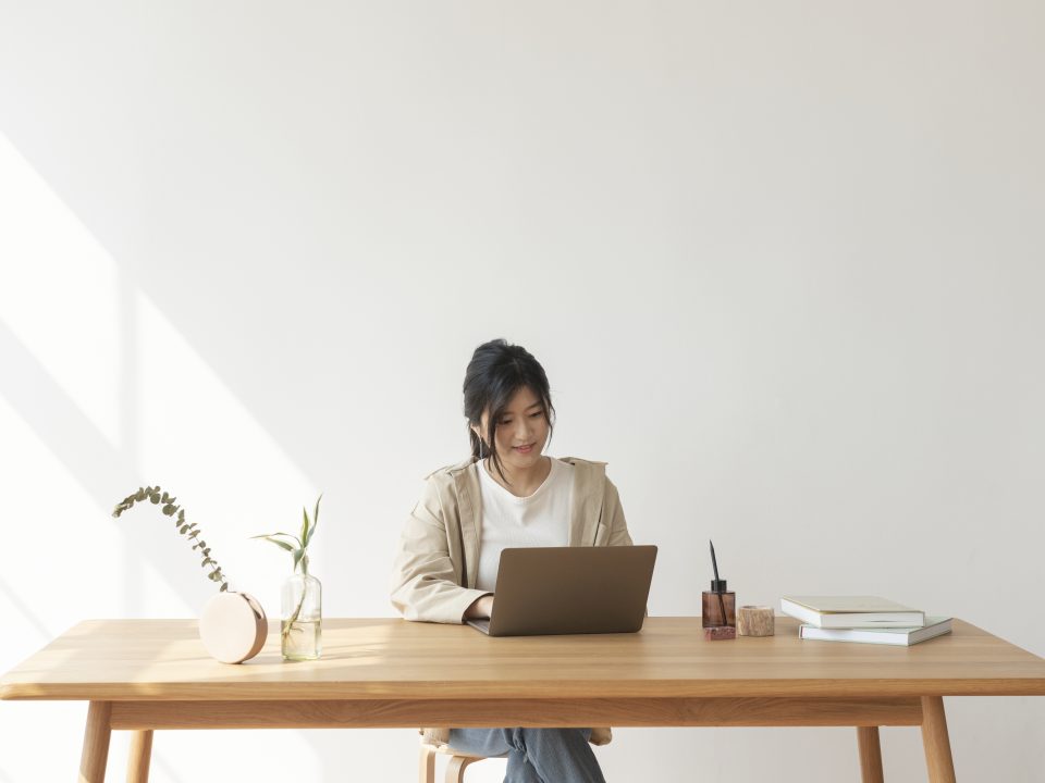 Happy Asian woman working from home